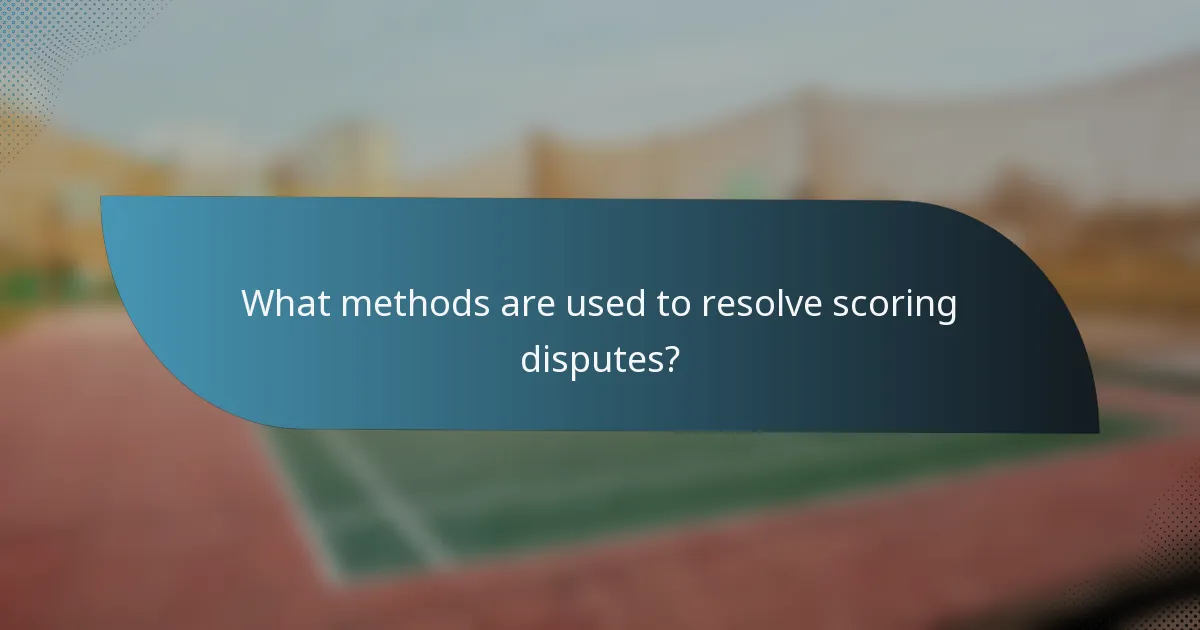 What methods are used to resolve scoring disputes?